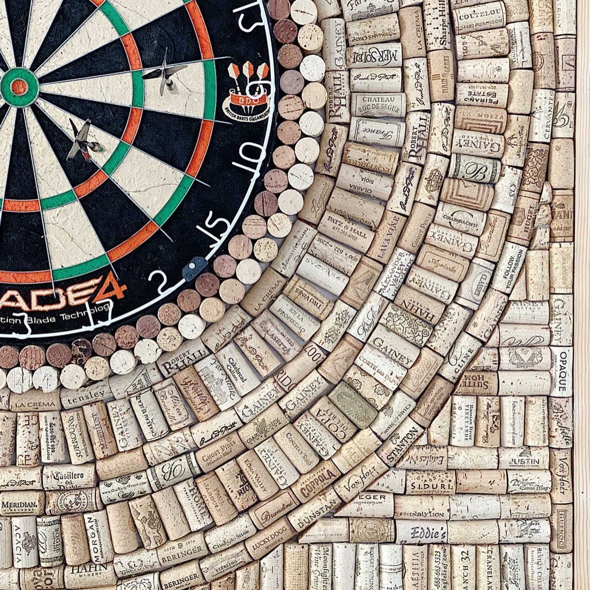 DIY Dart Board Backboard: 7 Clever Projects for Any Style 3 Dartboard mounted on a creative backboard made of arranged wine corks.