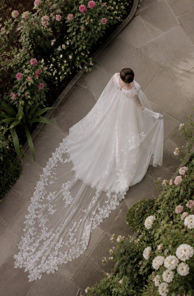 Fantasy Wedding Dresses: 8 Whimsical Styles for Dreamy Brides 11 Veil and cape adding drama to a wedding dress.