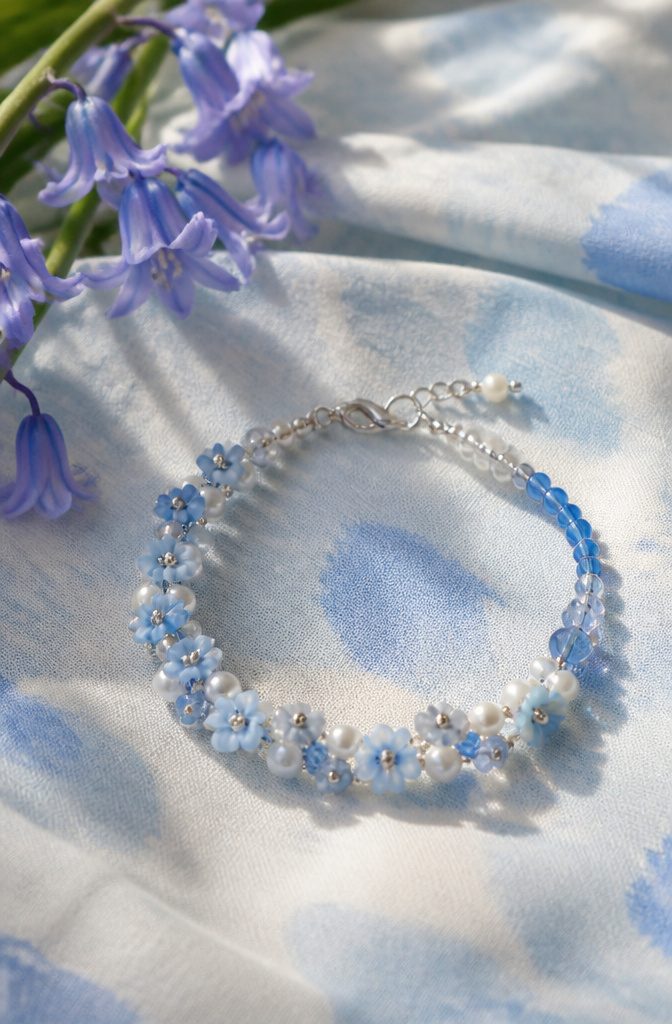 20 Handmade Jewelry Tutorials for Bracelets We Love 11 Bluebell Skies Bracelet on cloud-patterned fabric.