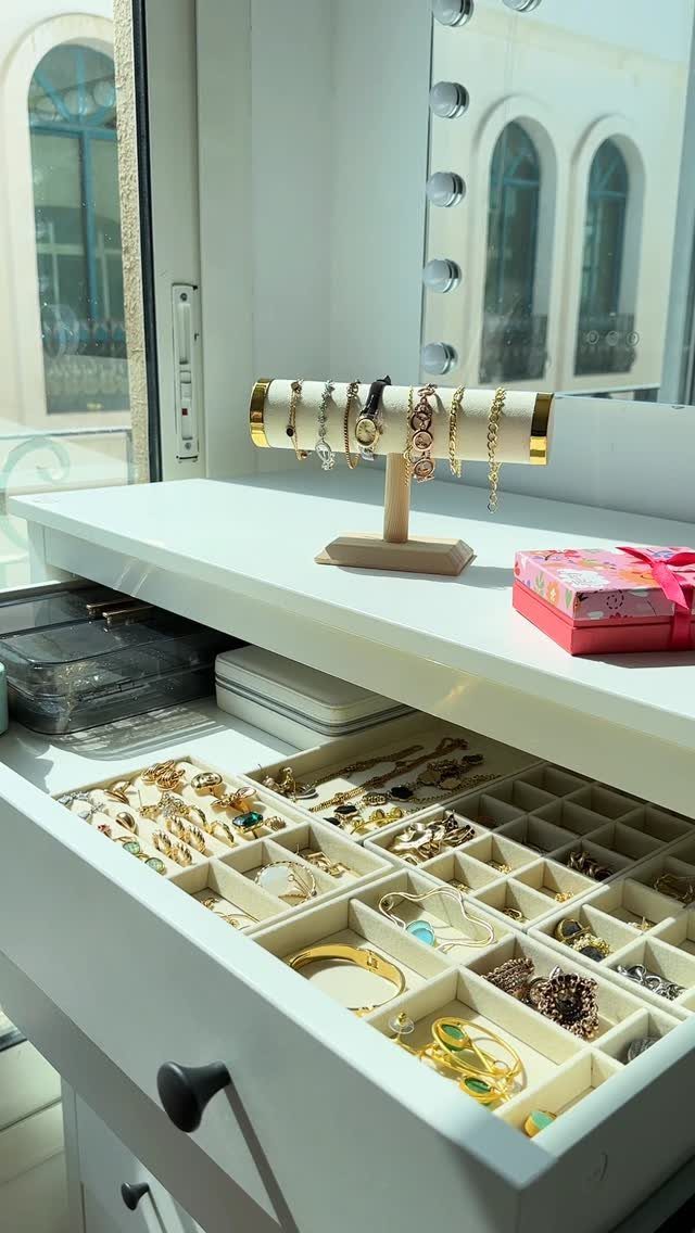 12 Ideas for Organizing Jewelry: Wall, Drawer & Travel Storage 9 Jewelry drawer with grid inserts and a gold T-bar bracelet stand on white dresser