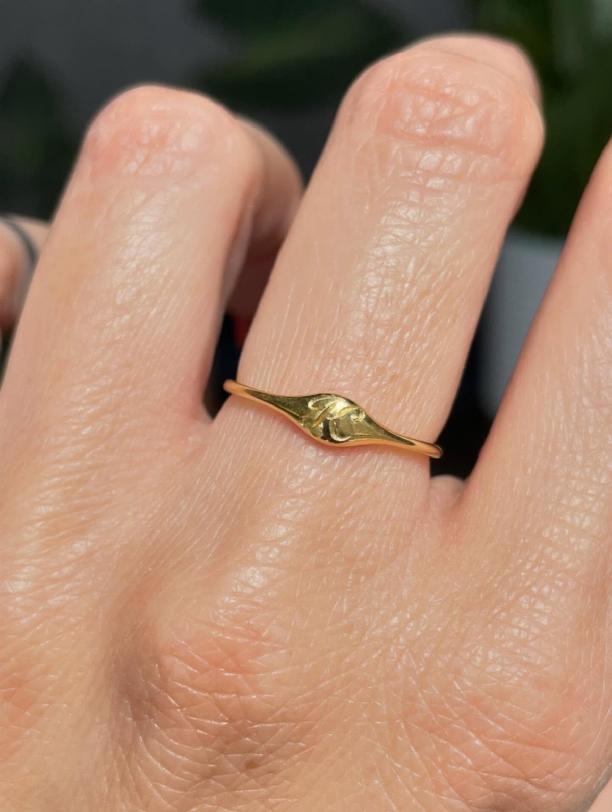 19 Jewelry Aesthetic Gold Ideas for Easy Style 15 Thin gold signet ring worn on a person's ring finger.