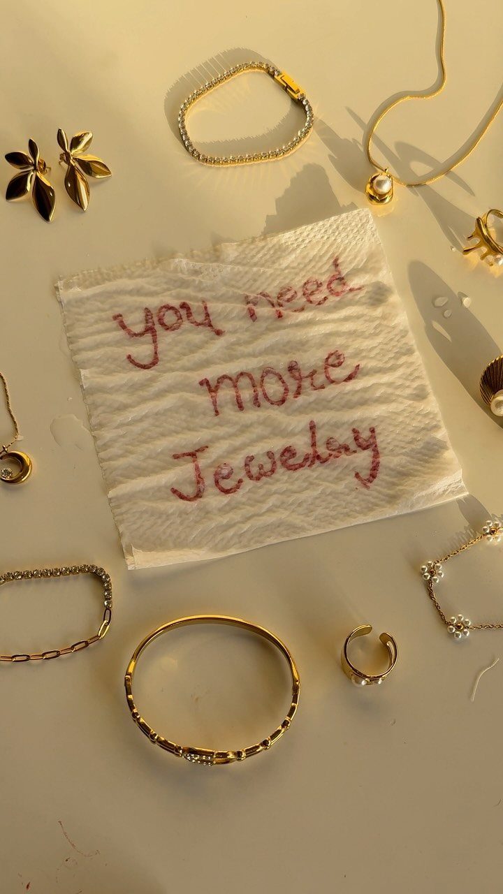 19 Jewelry Posting Ideas for Instagram That Build Sales 18 Gold jewelry pieces arranged around a napkin with red text saying you need more jewelry