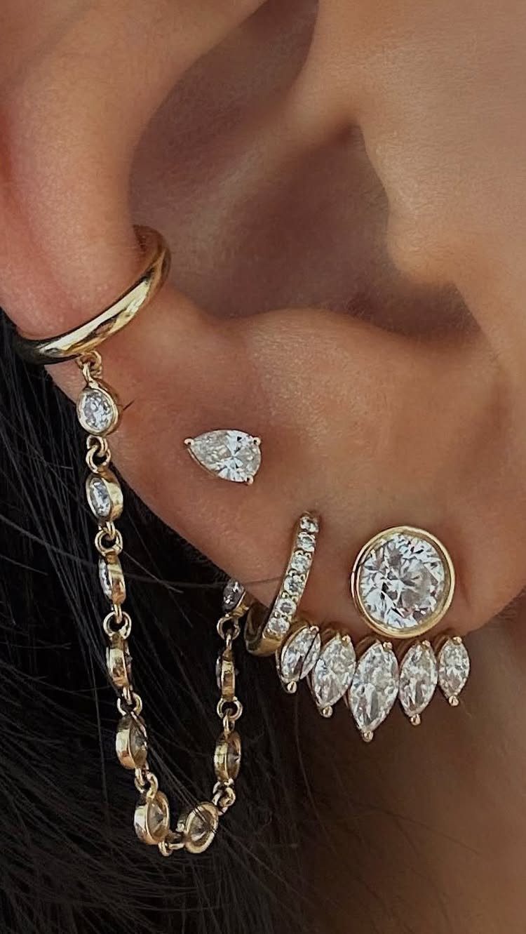 12 Jewelry Stack Inspo Earrings Ideas 8 Gold and diamond earring stack with chains and multiple studs on an ear