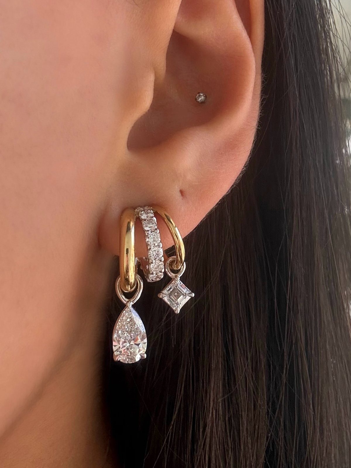 12 Jewelry Stack Inspo Earrings Ideas 9 Earring stack with gold and silver hoops featuring pear and square gemstone drops.