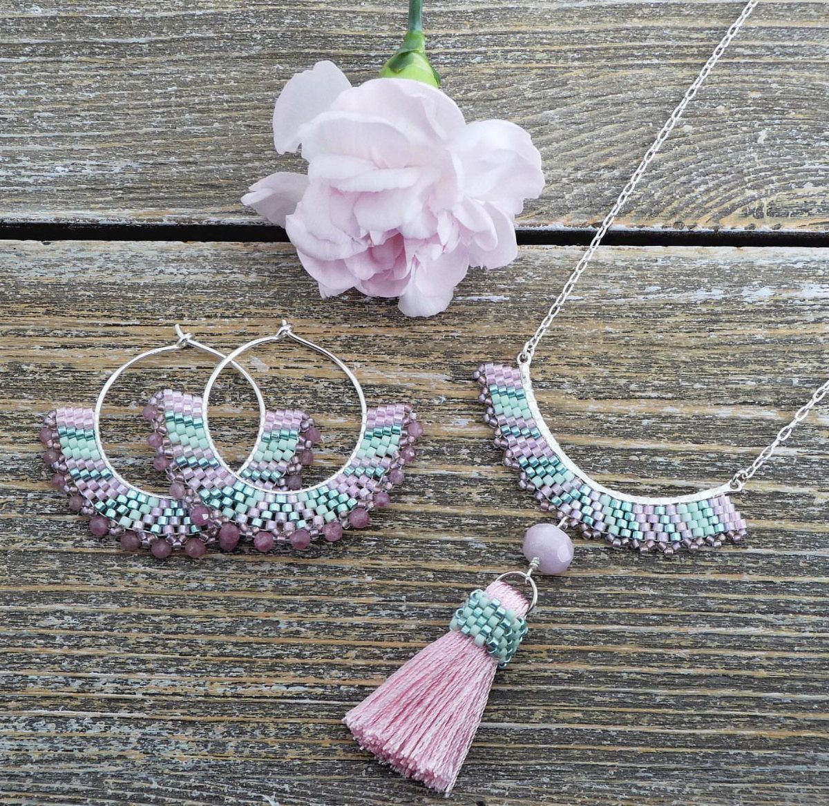Seed Bead Crafts: 19 Patterns and Projects for 2026 10 Beaded necklace and matching earrings with pink tassel on rustic wooden background
