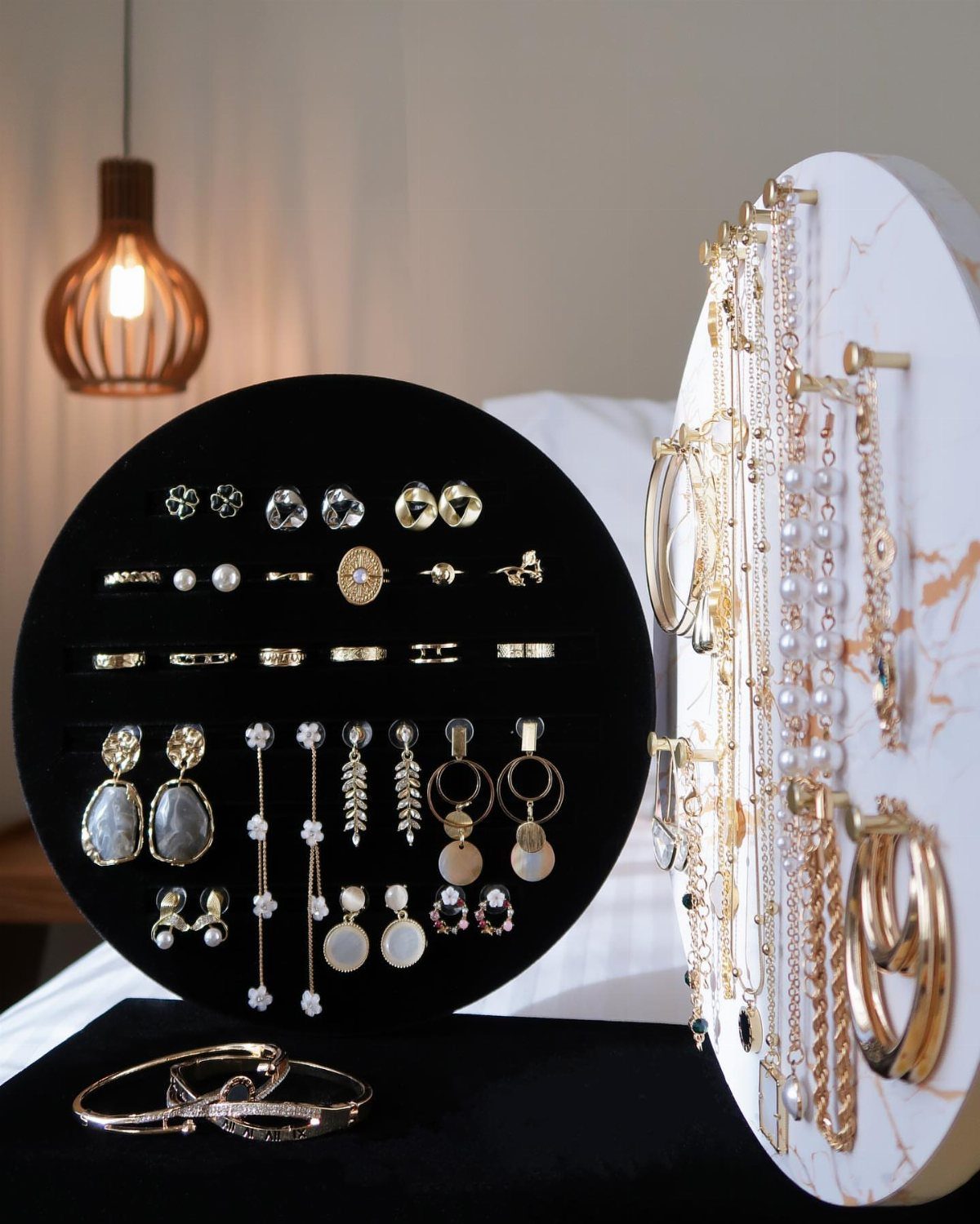 13 Stud Earring Storage Ideas for Every Jewelry Collection 4 Jewelry display stands holding gold and silver earrings, rings, and necklaces.