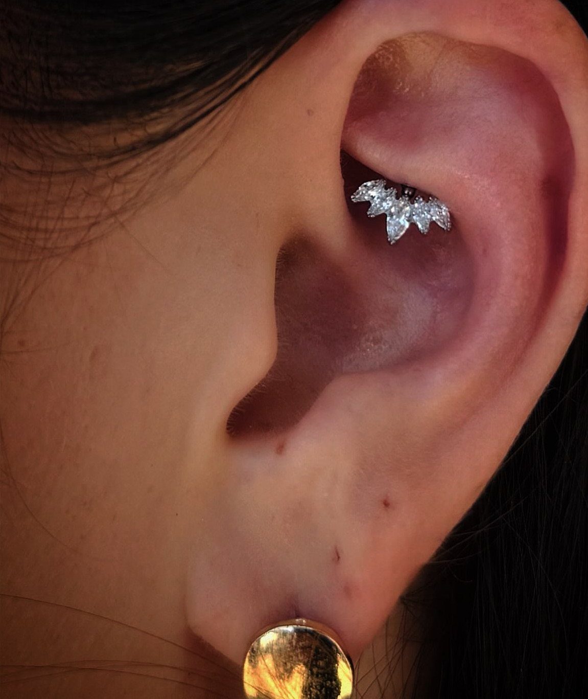 Top of the Ear Piercing Jewelry: 11 Ideas 11 Upper ear cartilage piercing with sparkling silver crystal jewelry and gold lobe stud.
